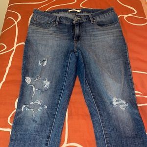 Distressed mid rise skinny jeans